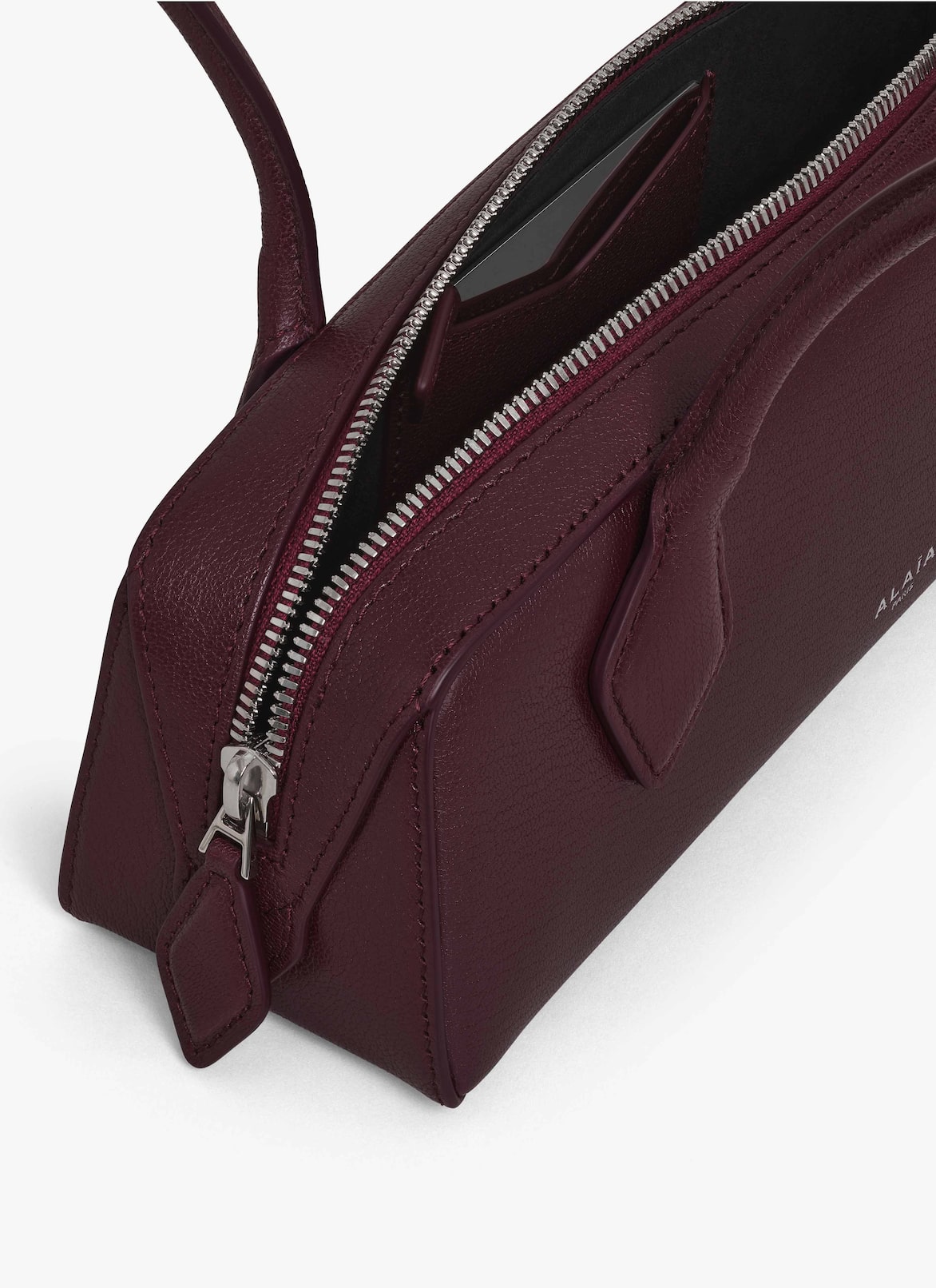 LE TECKEL SMALL BAG IN LEATHER ALAÏA GARNET RED LE TECKEL SMALL BAG IN LEATHER
